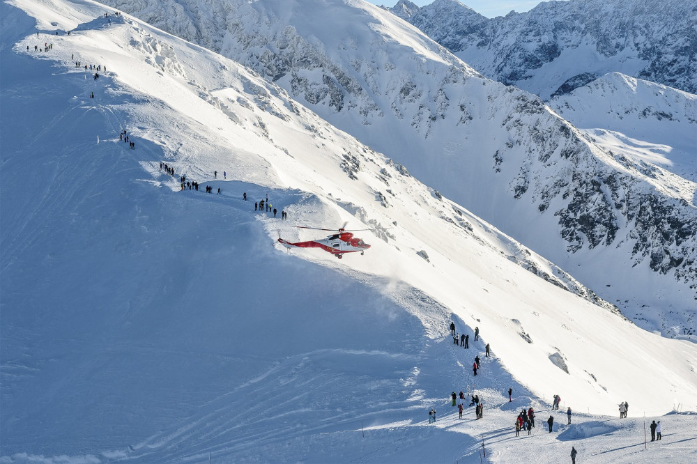 A rescue helicopter sits on the tourist trail near Kasprowy Wierch in Poland.