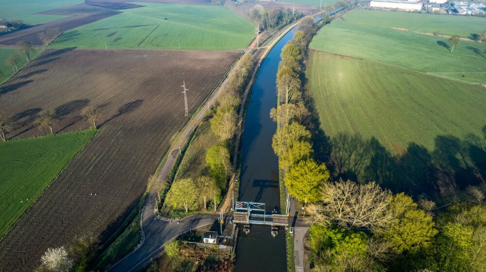 canal Dessel Schoten aerial photo in Rijkevorsel, kempen, Belgium, showing the waterway in the natural green agricultural landscape. High quality photo