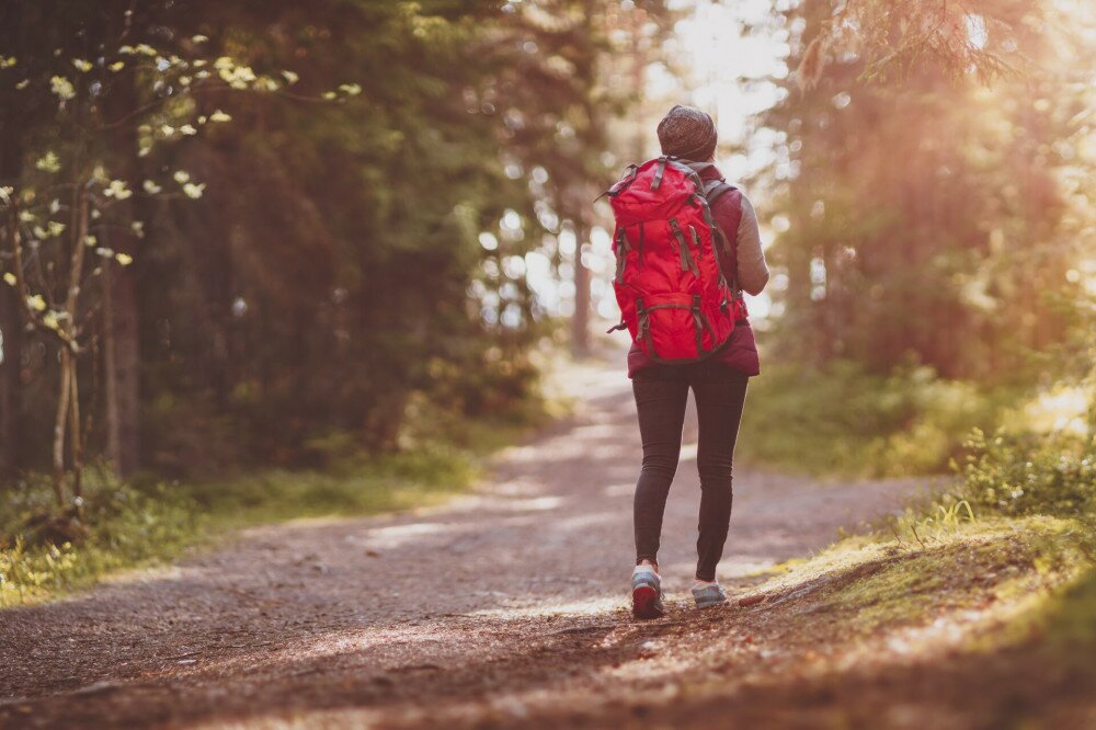 Woman hiking and going camping in nature